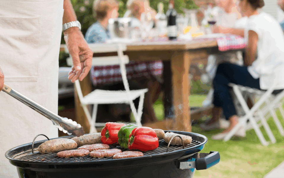 Person bbqing in their backyard
